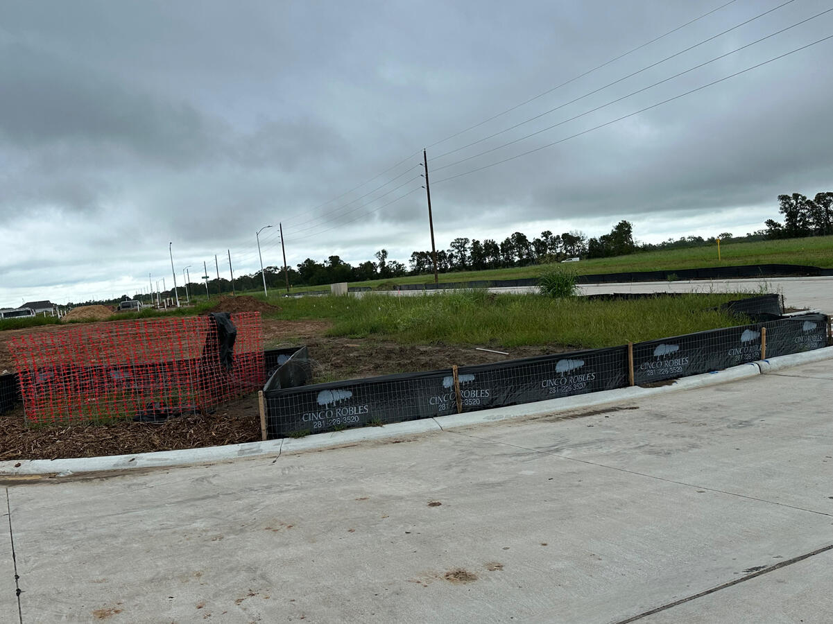 silt fence and trash bin